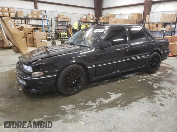 1988 Mitsubishi Galant with VIN E39A0010917, listed as a Copart auction lot 44421775 with 14,813 mi miles and Salvage Title. Bid and sale history available at DreamBid. Image 1.