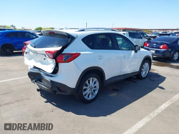 2015 Mazda CX-5 Grand Touring with VIN JM3KE2DYXF0493370, listed as a IAAI auction lot 42087156 with 161,464 mi miles. Bid and sale history available at carsss.com. Image 4.