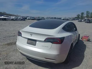 2022 Tesla Model 3 Long Range with VIN 5YJ3E1EB0NF106570, listed as a IAAI auction lot 41832622 with 52,679 mi miles and . Bid and sale history available at DreamBid. Image 4.