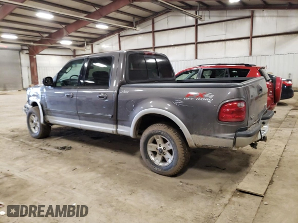 2002 Ford F-150 XLT with VIN 1FTRW08L92KD19411, listed as a Copart auction lot 50986795 with 164,556 mi miles and Clean Title. Bid and sale history available at carsss.com. Image 2.