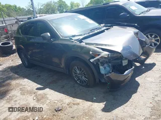 2017 Mazda CX-5 Touring with VIN JM3KFACL5H0197432, listed as a IAAI auction lot 42060117 with 1 mi miles. Bid and sale history available at carsss.com. Image 1.