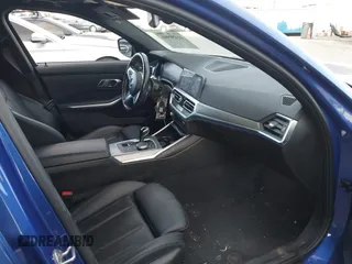 2022 BMW 3 Series 330i with VIN 3MW5R1J06N8C22729, listed as a IAAI auction lot 41450946 with 48,279 mi miles. Bid and sale history available at carsss.com. Image 5.