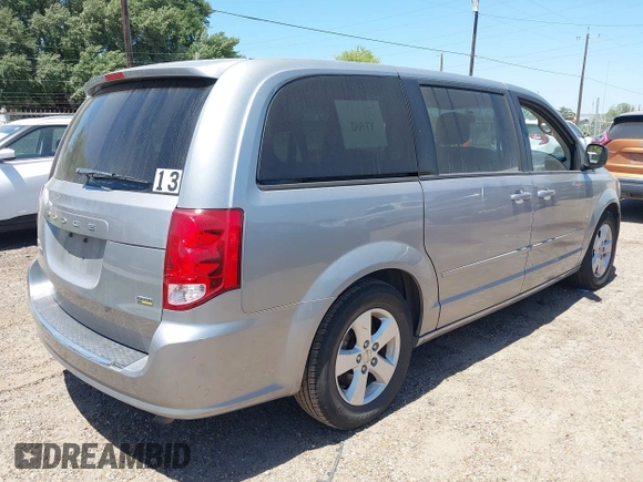 2013 Dodge Grand Caravan SE with VIN 2C4RDGBG0DR702913, listed as a IAAI auction lot 42007786 with 163,981 mi miles and . Bid and sale history available at DreamBid. Image 4.