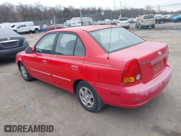 2005 Hyundai Accent GLS with VIN KMHCG45CX5U614083, listed as a IAAI auction lot 41006582 with 72,516 mi miles. Bid and sale history available at carsss.com. Image 3.