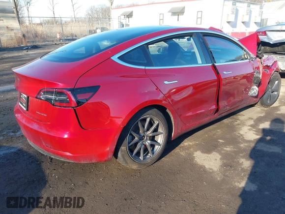 2018 Tesla Model 3 Long Range Battery with VIN 5YJ3E1EB4JF065581, listed as a IAAI auction lot 41542190 with 4,154 mi miles and . Bid and sale history available at DreamBid. Image 4.