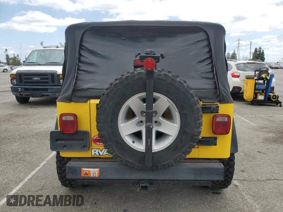 2004 Jeep Wrangler Rubicon with VIN 1J4FA69SX4P768963, listed as a Copart auction lot 56999665 with 91,949 mi miles and Salvage title. Bid and sale history available at DreamBid. Image 6.