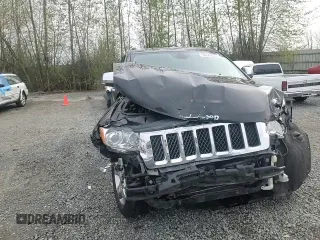 2013 Jeep Grand Cherokee Overland with VIN 1C4RJFCGXDC643802, listed as a Copart auction lot 52429535 with 122,014 mi miles and Salvage Title. Bid and sale history available at carsss.com. Image 11.