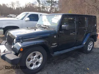2015 Jeep Wrangler Unlimited Sahara with VIN 1C4BJWEGXFL506361, listed as a IAAI auction lot 41865418 with 80,841 mi miles. Bid and sale history available at carsss.com. Image 14.