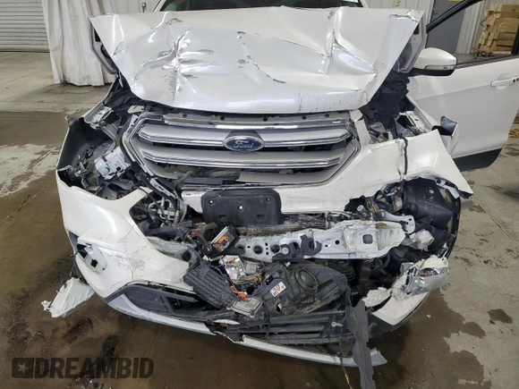 2019 Ford Escape Titanium z VIN 1FMCU9J97KUA85865, wystawiony jako Copart lot #56643135 z przebiegiem Nie podano mil oraz Szkoda całkowita • Salvage title. Historia ofert i sprzedaży dostępna na DreamBid. Obrazek 12.