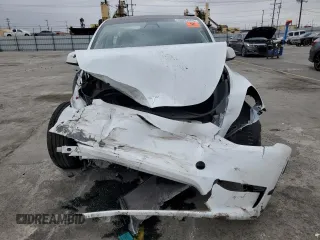2023 Tesla Model Y Long Range z VIN 7SAYGDEE9PA070232, wystawiony jako Copart lot #55881805 z przebiegiem 38 276 mil mil oraz Szkoda całkowita • Salvage title. Historia ofert i sprzedaży dostępna na DreamBid. Obrazek 5.