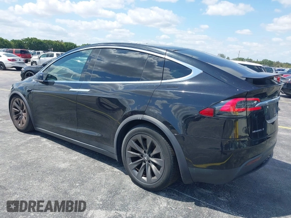 2017 Tesla Model X 90D with VIN 5YJXCBE21HF054898, listed as a IAAI auction lot 42076462 with 89,996 mi miles and . Bid and sale history available at DreamBid. Image 3.