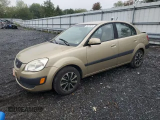 2009 Kia Rio LX with VIN KNADE223096485561, listed as a Copart auction lot 73412874 with 137,858 mi miles and Salvage Title. Bid and sale history available at DreamBid. Image 1.