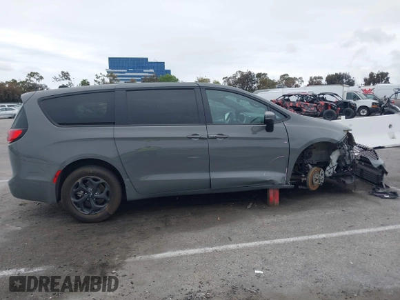 2023 Chrysler Pacifica Hybrid Touring L with VIN 2C4RC1L71PR584485, listed as a IAAI auction lot 42056423 with 58,955 mi miles and . Bid and sale history available at DreamBid. Image 14.