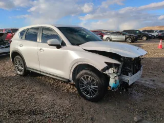 2021 Mazda CX-5 Touring with VIN JM3KFBCM0M0355894, listed as a Copart auction lot 83593464 with 80,703 mi miles and Salvage Title. Bid and sale history available at carsss.com. Image 4.