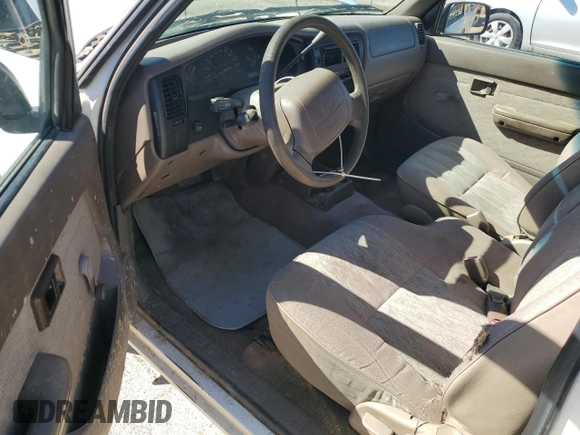 1999 Toyota Tacoma z VIN 4TAVL52N1XZ513889, wystawiony jako Copart lot #50007235 z przebiegiem 225 799 mil mil oraz Szkoda całkowita • Salvage title. Historia ofert i sprzedaży dostępna na DreamBid. Obrazek 8.