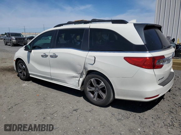 2018 Honda Odyssey Touring with VIN 5FNRL6H8XJB018438, listed as a Copart auction lot 61876505 with 104,581 mi miles and Salvage title. Bid and sale history available at DreamBid. Image 2.