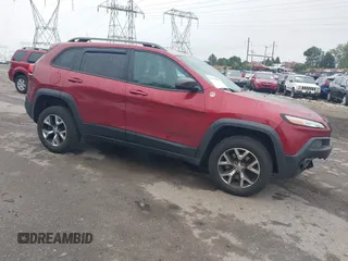 2015 Jeep Cherokee Trailhawk with VIN 1C4PJMBSXFW667469, listed as a IAAI auction lot 42438006 with 127,136 mi miles and . Bid and sale history available at DreamBid. Image 1.