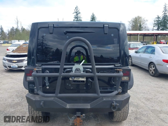 2014 Jeep Wrangler Unlimited Sahara with VIN 1C4BJWEG6EL107526, listed as a IAAI auction lot 42030244 with 69,077 mi miles. Bid and sale history available at carsss.com. Image 16.