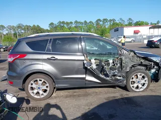 2016 Ford Escape Titanium with VIN 1FMCU9J94GUA63359, listed as a IAAI auction lot 41954514 with 94,315 mi miles. Bid and sale history available at carsss.com. Image 13.