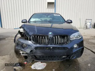 2015 BMW X6 xDrive50i with VIN 5UXKU6C56F0F93641, listed as a Copart auction lot 77233553 with 71,409 mi miles. Bid and sale history available at carsss.com. Image 5.