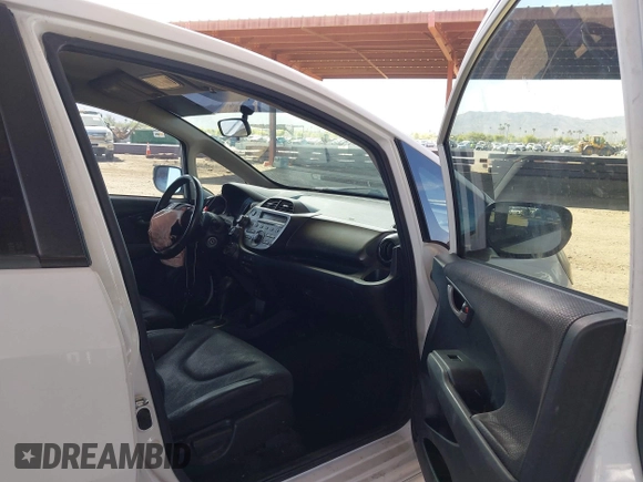 2012 Honda Fit Sport with VIN JHMGE8H55CC000608, listed as a IAAI auction lot 42025275 with 111,621 mi miles. Bid and sale history available at carsss.com. Image 5.
