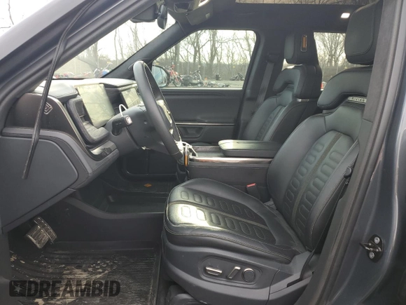 2022 Rivian R1T Adventure Package with VIN 7FCTGAAAXNN005667, listed as a Copart auction lot 44321435 with 48,249 mi miles and Salvage Title. Bid and sale history available at carsss.com. Image 7.
