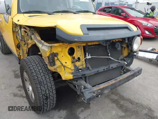 2007 Toyota FJ Cruiser with VIN JTEBU11FX70037231, listed as a IAAI auction lot 42018669 with 129,670 mi miles. Bid and sale history available at carsss.com. Image 6.