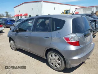 2009 Honda Fit with VIN JHMGE88249S036133, listed as a IAAI auction lot 41788358 with 128,613 mi miles. Bid and sale history available at carsss.com. Image 3.