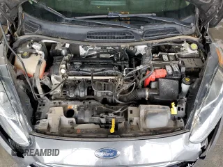 2017 Ford Fiesta SE z VIN 3FADP4BJ9HM165523, wystawiony jako Copart lot #70295532 z przebiegiem 91 318 mil mil oraz Szkoda całkowita • Salvage title. Historia ofert i sprzedaży dostępna na DreamBid. Obrazek 11.