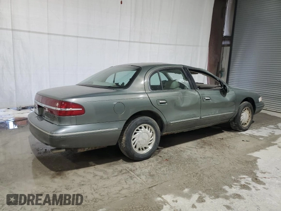 1997 Lincoln Continental with VIN 1LNLM97VXVY624609, listed as a Copart auction lot 73921634 with 119,746 mi miles and Salvage Title. Bid and sale history available at carsss.com. Image 3.