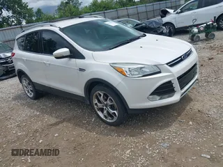 2016 Ford Escape Titanium with VIN 1FMCU9J90GUC76504, listed as a IAAI auction lot 42552851 with 89,570 mi miles and . Bid and sale history available at DreamBid. Image 1.