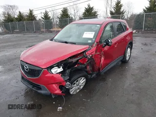 2014 Mazda CX-5 Touring with VIN JM3KE2CY2E0322211, listed as a IAAI auction lot 41721219 with 127,312 mi miles. Bid and sale history available at carsss.com. Image 2.