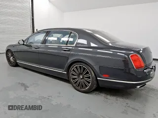 2013 Bentley Flying Spur z VIN SCBBP9ZA4DC081659, wystawiony jako Copart lot #57568525 z przebiegiem 102 570 mil mil oraz Czysty tytuł • Clean title. Historia ofert i sprzedaży dostępna na DreamBid. Obrazek 2.