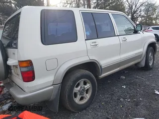 1999 Isuzu Trooper S with VIN JACDJ58X1X7928946, listed as a IAAI auction lot 41310880 with Not Provided miles and . Bid and sale history available at DreamBid. Image 4.