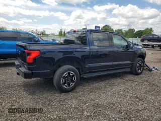 2022 Ford F-150 Lightning Pro z VIN 1FTVW1EL6NWG04931, wystawiony jako Copart lot #59096435 z przebiegiem 26 616 mil mil oraz Szkody całkowita. Historia ofert i sprzedaży dostępna na DreamBid. Obrazek 3.