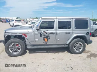 2018 Jeep Wrangler Unlimited Sahara with VIN 1C4HJXEG4JW115522, listed as a IAAI auction lot 42322791 with 68,409 mi miles and . Bid and sale history available at DreamBid. Image 14.