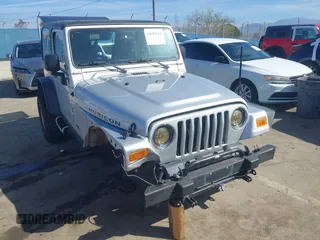 2004 Jeep Wrangler Rubicon with VIN 1J4FA69S94P701660, listed as a IAAI auction lot 41699554 with 74,640 mi miles. Bid and sale history available at carsss.com. Image 1.
