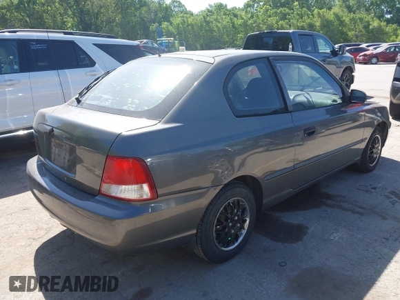 2001 Hyundai Accent GLS z VIN KMHCG35C01U136132, wystawiony jako IAAI lot #42293830 z przebiegiem 111 906 mil mil oraz . Historia ofert i sprzedaży dostępna na DreamBid. Obrazek 4.