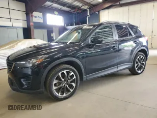 2016 Mazda CX-5 Grand Touring z VIN JM3KE4DY1G0665427, wystawiony jako Copart lot #58003065 z przebiegiem 184 471 mil mil oraz Czysty tytuł • Clean title. Historia ofert i sprzedaży dostępna na DreamBid. Obrazek 1.