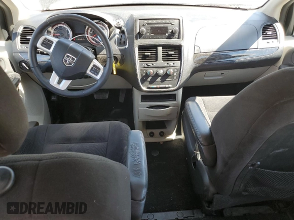 2014 Dodge Grand Caravan American Value with VIN 2C4RDGBG2ER361449, listed as a Copart auction lot 54940615 with 85,012 mi miles and Salvage Title. Bid and sale history available at DreamBid. Image 8.