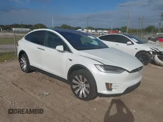 2020 Tesla Model X Long Range with VIN 5YJXCDE20LF272013, listed as a IAAI auction lot 41736653 with 74,725 mi miles. Bid and sale history available at carsss.com. Image 1.