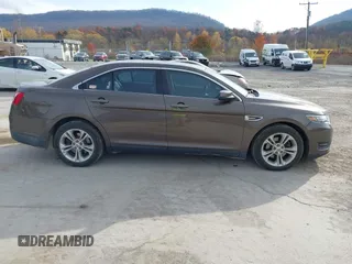 2015 Ford Taurus SEL with VIN 1FAHP2H87FG199865, listed as a IAAI auction lot 40760225 with 77,782 mi miles. Bid and sale history available at carsss.com. Image 13.