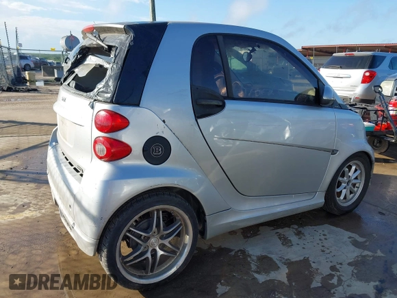2009 Smart fortwo Pure with VIN WMEEJ31X09K301824, listed as a IAAI auction lot 42088793 with 51,948 mi miles. Bid and sale history available at carsss.com. Image 4.