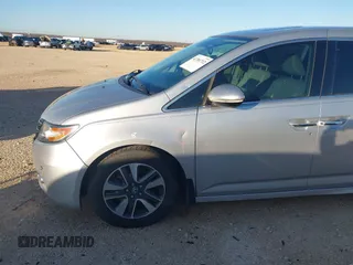 2014 Honda Odyssey Touring with VIN 5FNRL5H97EB094353, listed as a IAAI auction lot 41701712 with 141,228 mi miles and . Bid and sale history available at DreamBid. Image 19.
