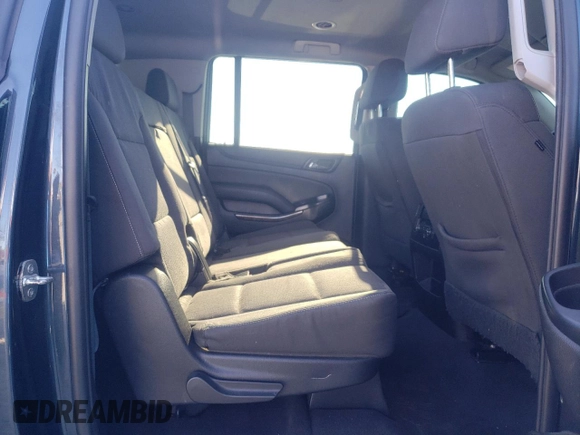 2019 Chevrolet Suburban LS z VIN 1GNSCGKCXKR156097, wystawiony jako Copart lot #64475154 z przebiegiem 101 739 mil mil oraz Nie do naprawy • Non repairable. Historia ofert i sprzedaży dostępna na DreamBid. Obrazek 11.