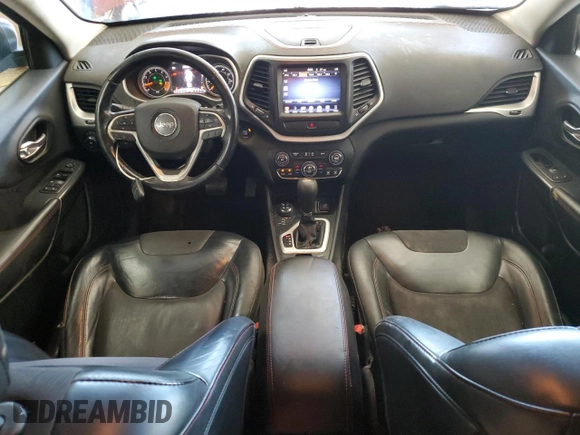 2015 Jeep Cherokee Trailhawk with VIN 1C4PJMBS1FW745928, listed as a Copart auction lot 62032585 with 132,559 mi miles and Salvage title. Bid and sale history available at DreamBid. Image 8.