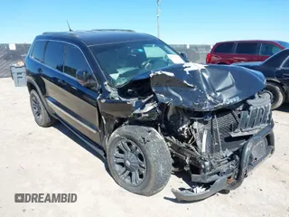 2013 Jeep Grand Cherokee Laredo with VIN 1C4RJFAG2DC643926, listed as a IAAI auction lot 41723575 with 125,048 mi miles. Bid and sale history available at carsss.com. Image 1.