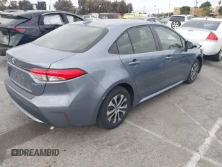 2022 Toyota Corolla Hybrid LE with VIN JTDEAMDE4NJ041913, listed as a IAAI auction lot 41883490 with 23,063 mi miles. Bid and sale history available at carsss.com. Image 4.