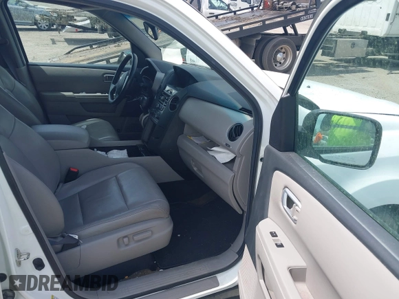 2014 Honda Pilot EX-L with VIN 5FNYF3H50EB005811, listed as a IAAI auction lot 42115804 with 216,033 mi miles and . Bid and sale history available at DreamBid. Image 5.