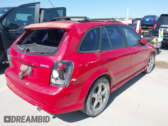 2002 Mazda Protege with VIN JM1BJ246721565634, listed as a IAAI auction lot 41984727 with 235,764 mi miles and . Bid and sale history available at DreamBid. Image 4.